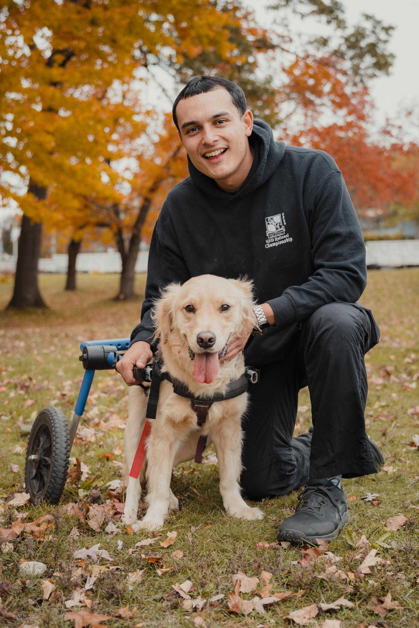 Steven Alejandro, Skill Tree K9 dog trainer, outdoors with a golden retriever